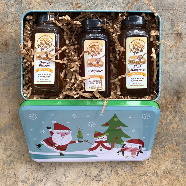 https://beefriendsfarm.com/cdn/shop/products/honey-sampler-festive-gift-tin-535263_800x600.jpg?v=1701287695